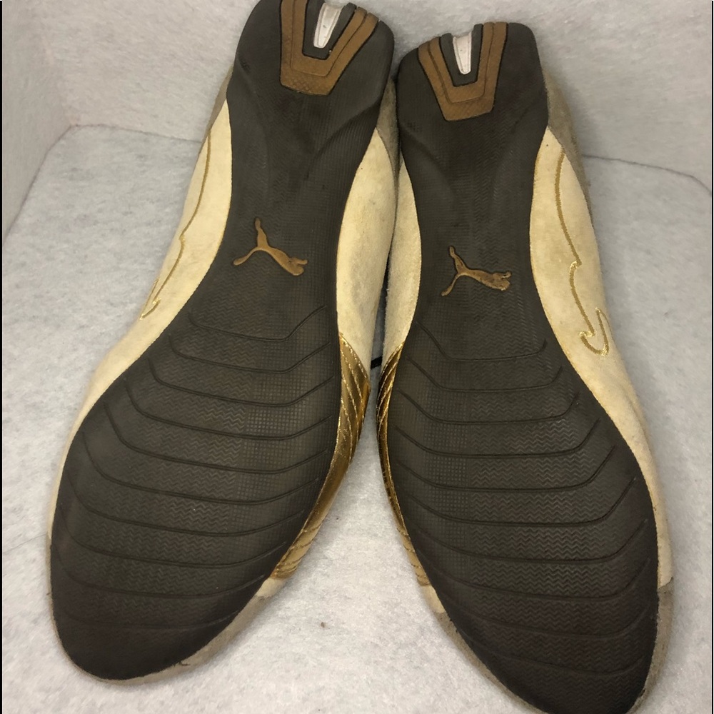 Gold puma sneakers